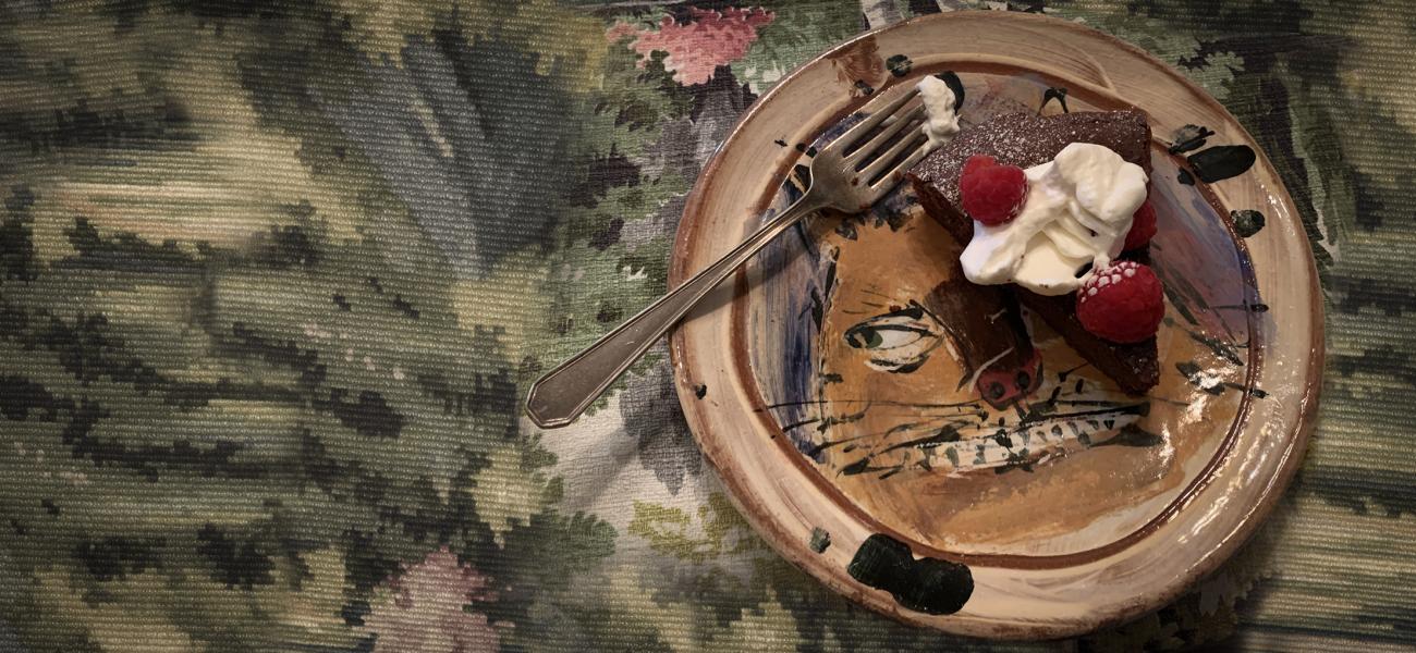 Surprise! Ron Meyers Dessert Plate.  At many a house in Athens, when invited for a meal, you could be presented with fantastic pottery that peeks through whatever delicious thing that is being served.